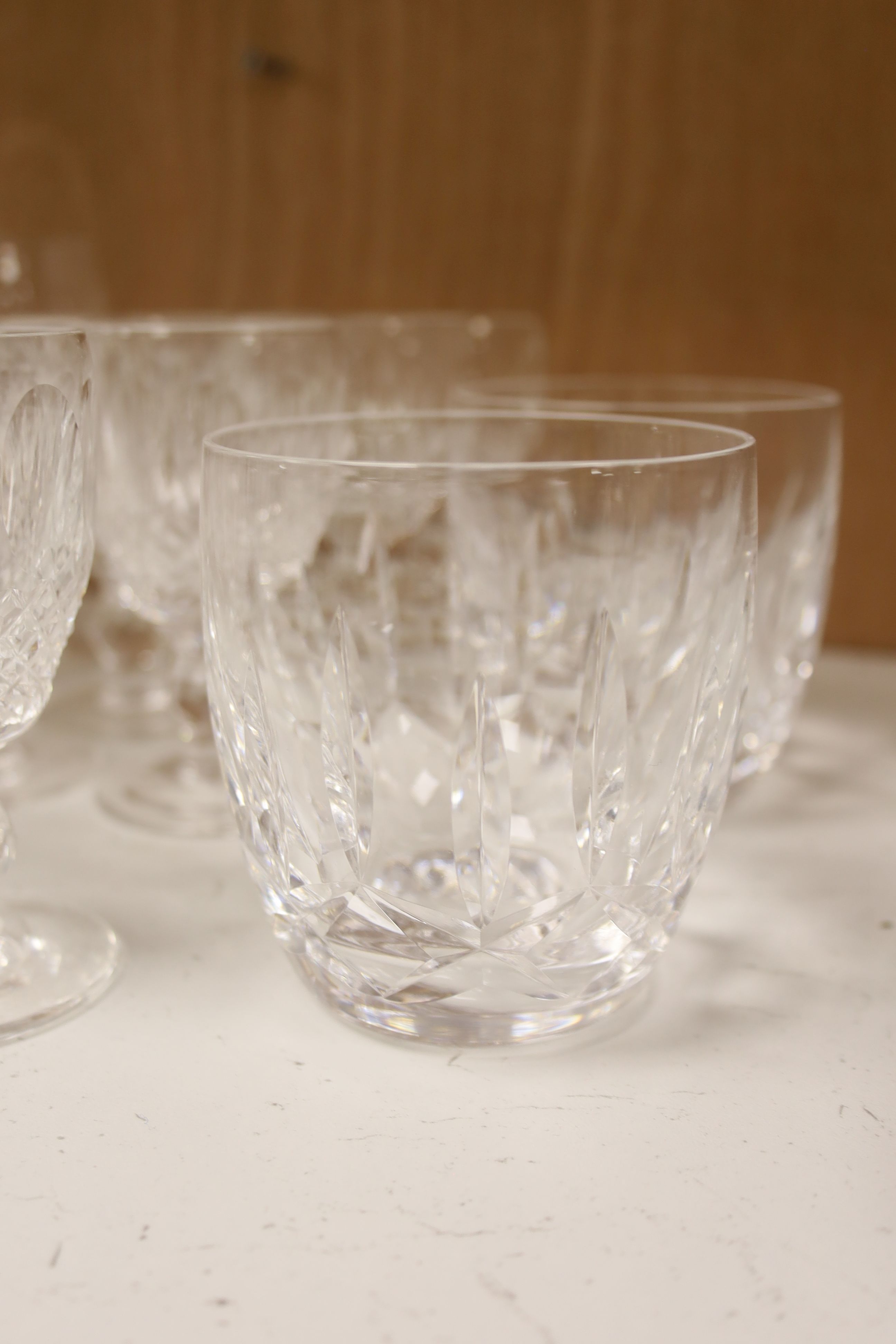 A collection of Waterford Colleen cut glasses and port glasses and two Lismore cut tumblers